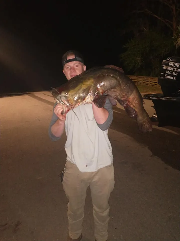Angler proudly showing off a trophy catch on a Stykn Fyns charter
