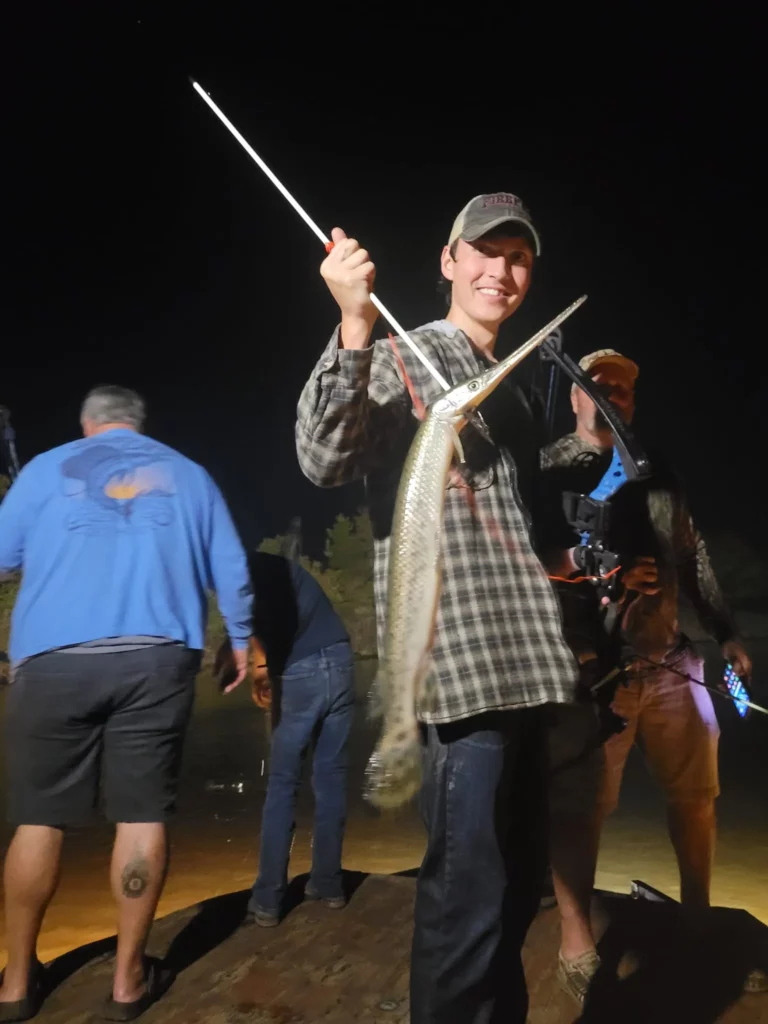 Young angler celebrating a catch on a family fishing charter