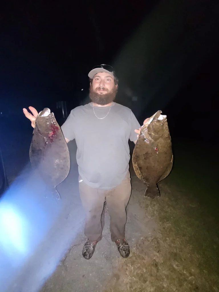 Guest posing with a bull red drum near New Bern, NC