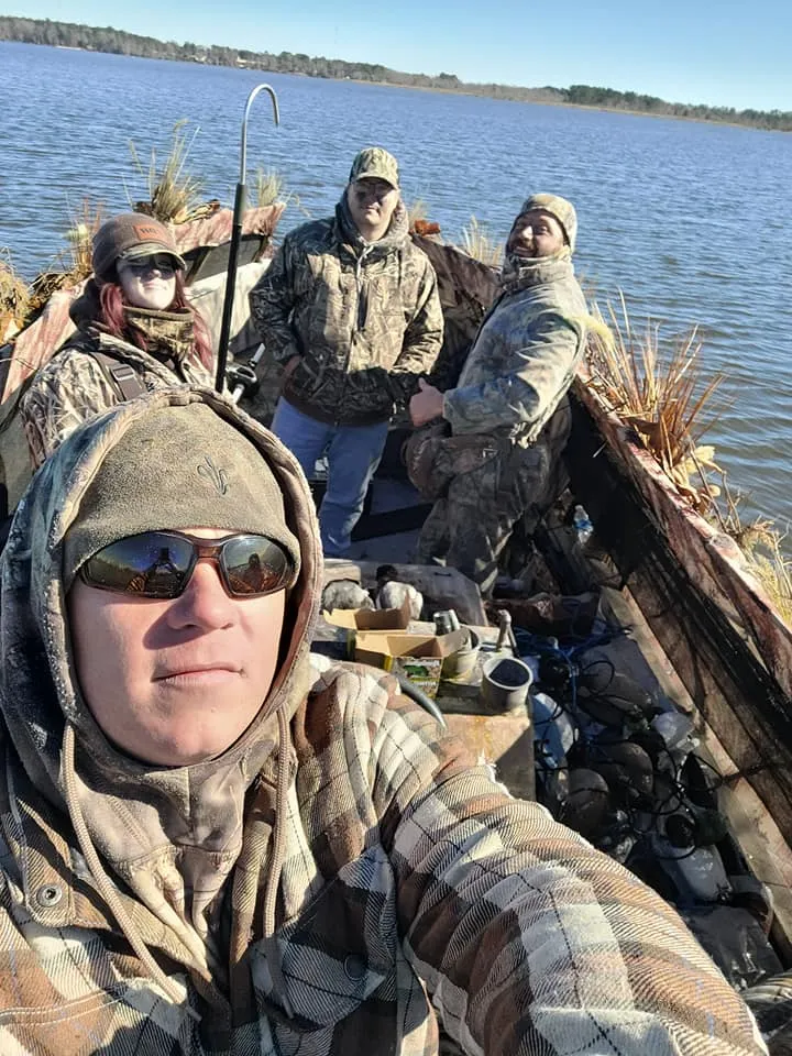 Family enjoying a rod and reel fishing trip on the water
