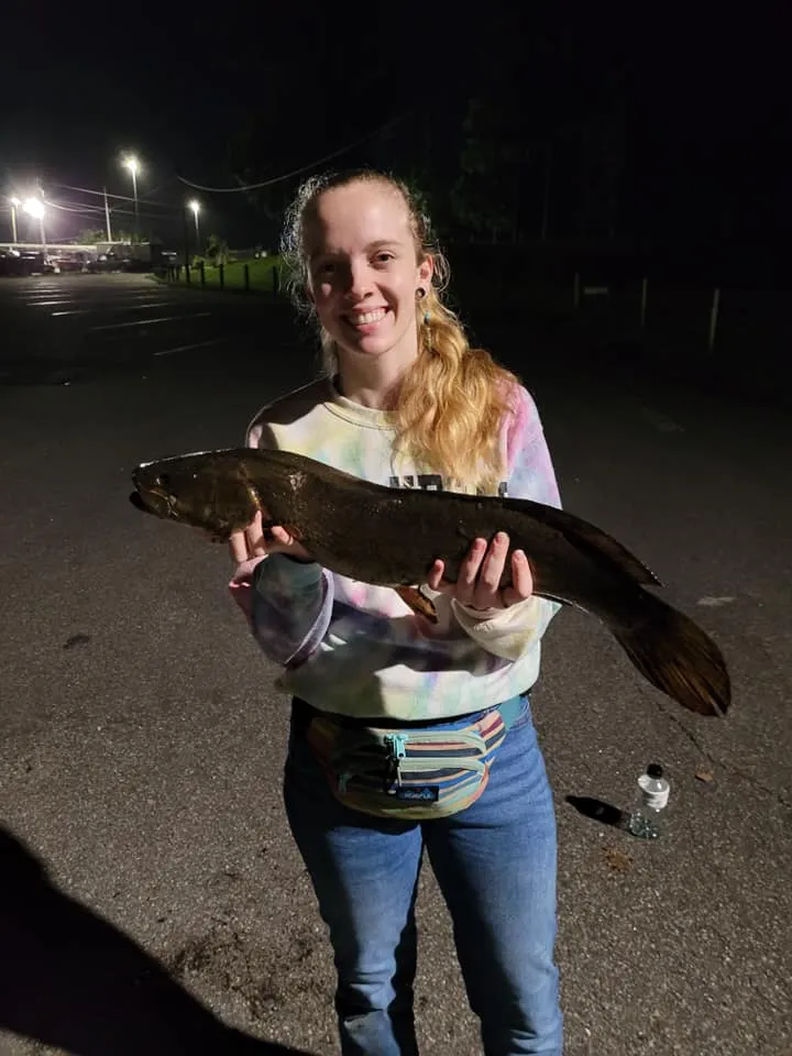 Angler with a large mullet caught bowfishing